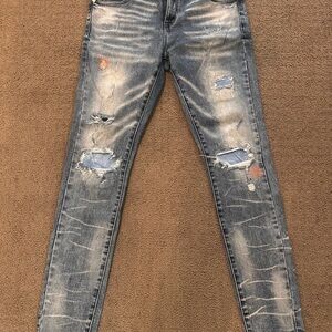 Distressed thrt blue skinny Jeans